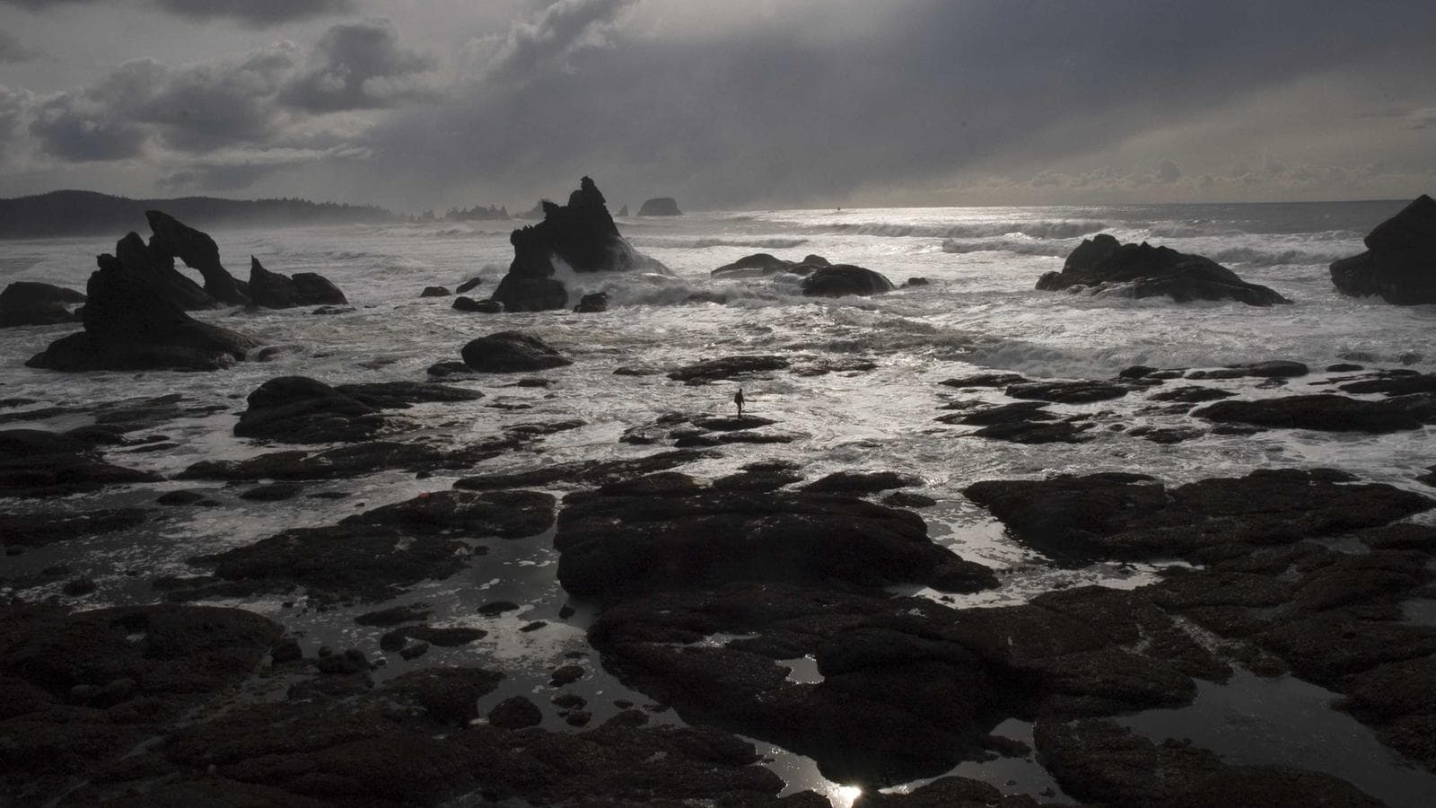 A wide shot of an evening reception with glowing candlelight