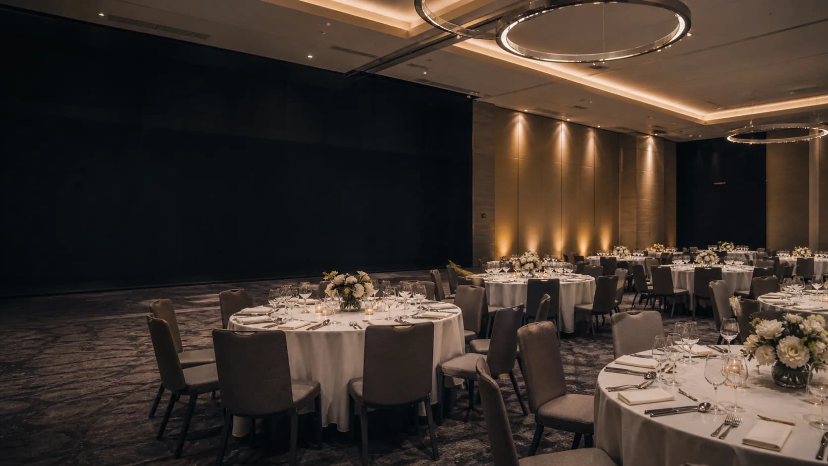 Corporate event under a white tent with banquet tables